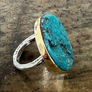 Jes MaHarry one of a kind ring with a rough, unpolished turquoise in gold bezel.